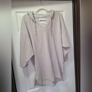 Victoria's Secret oversized hoodie features a V-neck, drawstring hood